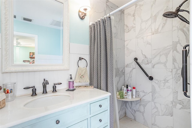 bathroom with a shower with curtain and vanity