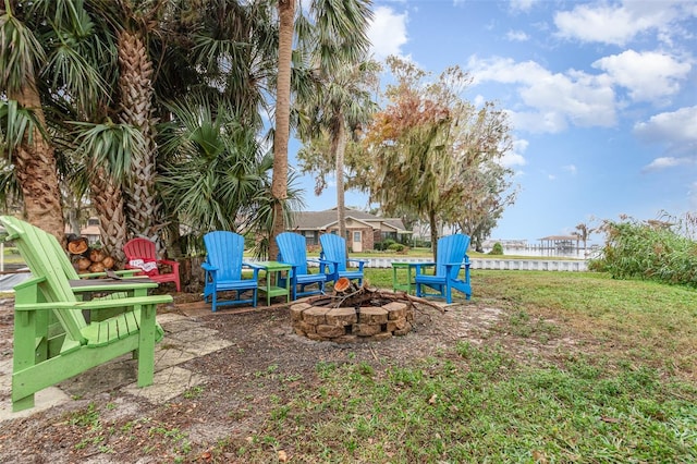 view of yard featuring an outdoor fire pit