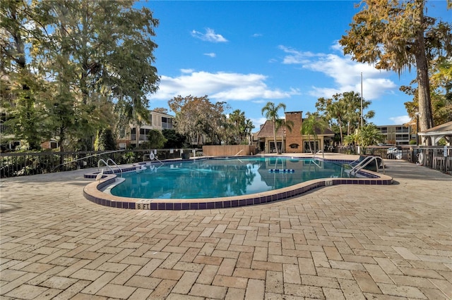 view of pool featuring a patio