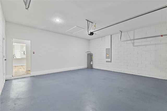 garage featuring electric panel, water heater, and a garage door opener