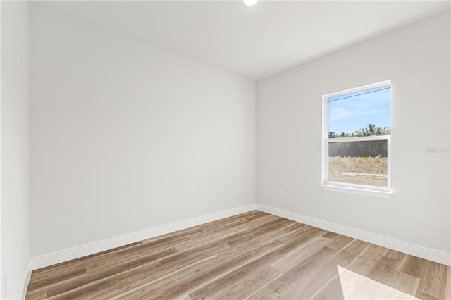 spare room featuring light wood-type flooring