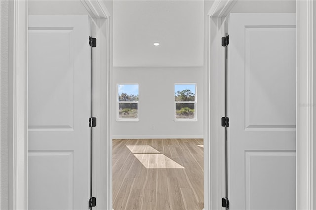 hall with light wood-type flooring