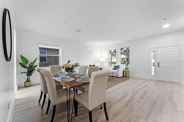 dining area with light hardwood / wood-style flooring