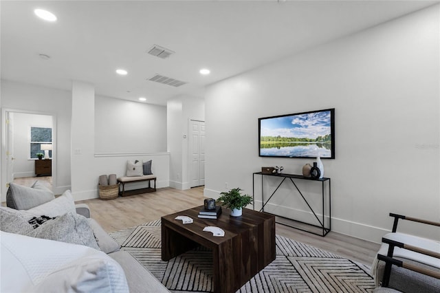 living room with light hardwood / wood-style flooring