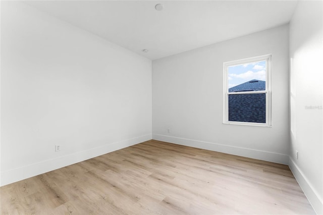 unfurnished room with light hardwood / wood-style floors