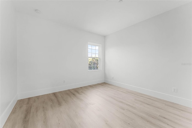 spare room featuring light wood-type flooring