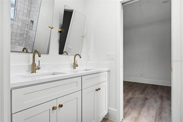 bathroom featuring vanity and wood-type flooring