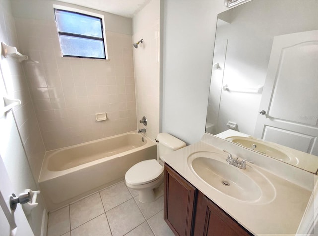 full bathroom with tile patterned floors, vanity, toilet, and tiled shower / bath