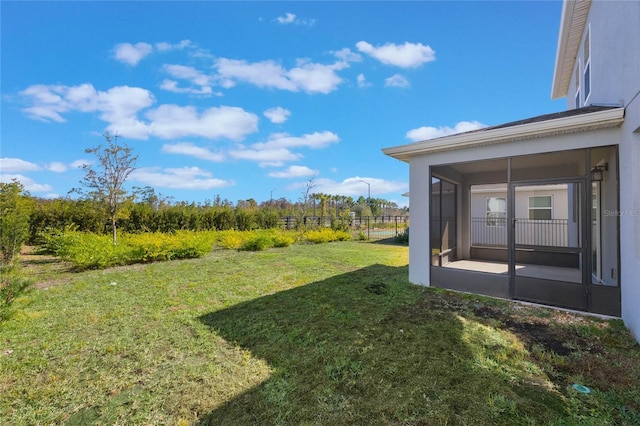 view of yard featuring a sunroom