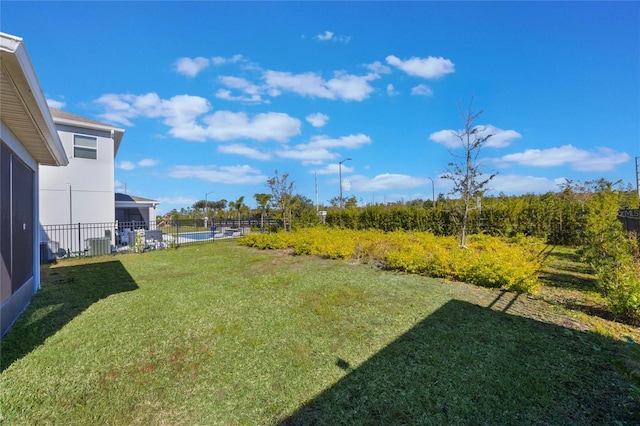 view of yard featuring central AC unit