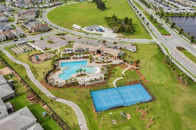 birds eye view of property with a water view