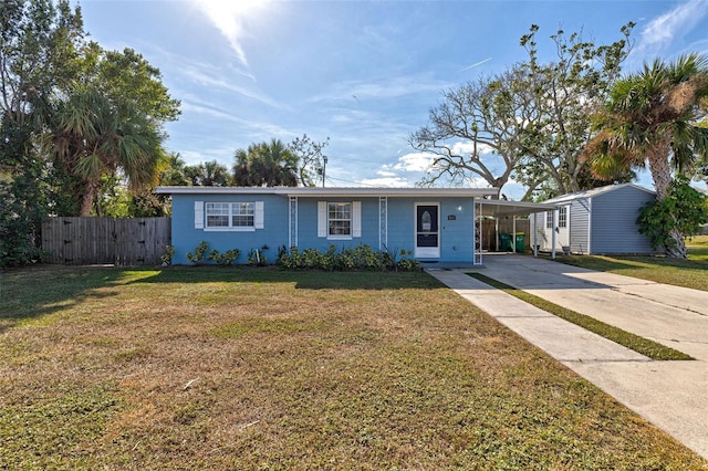 ranch-style home with a front lawn and a carport