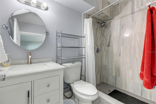 bathroom featuring a shower with curtain, toilet, and vanity