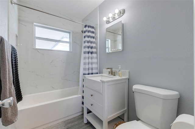 full bathroom featuring shower / bath combo, vanity, hardwood / wood-style flooring, and toilet