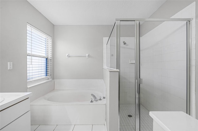 bathroom featuring tile patterned flooring, vanity, and independent shower and bath