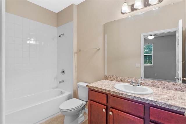 full bathroom featuring tile patterned flooring, vanity, toilet, and tiled shower / bath combo