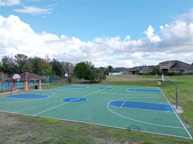 view of sport court with a gazebo and a yard