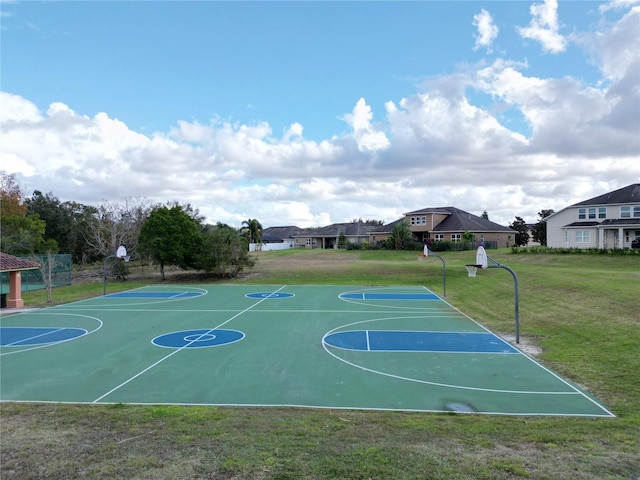 view of basketball court featuring a lawn