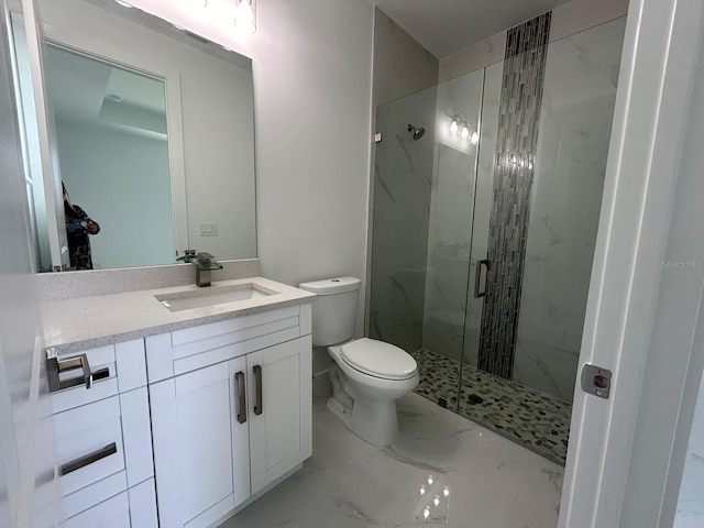 bathroom featuring walk in shower, vanity, and toilet