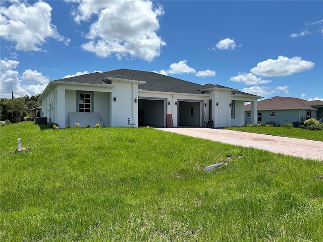 view of front of property featuring a garage and a front lawn