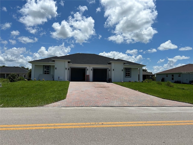 single story home with a garage and a front yard