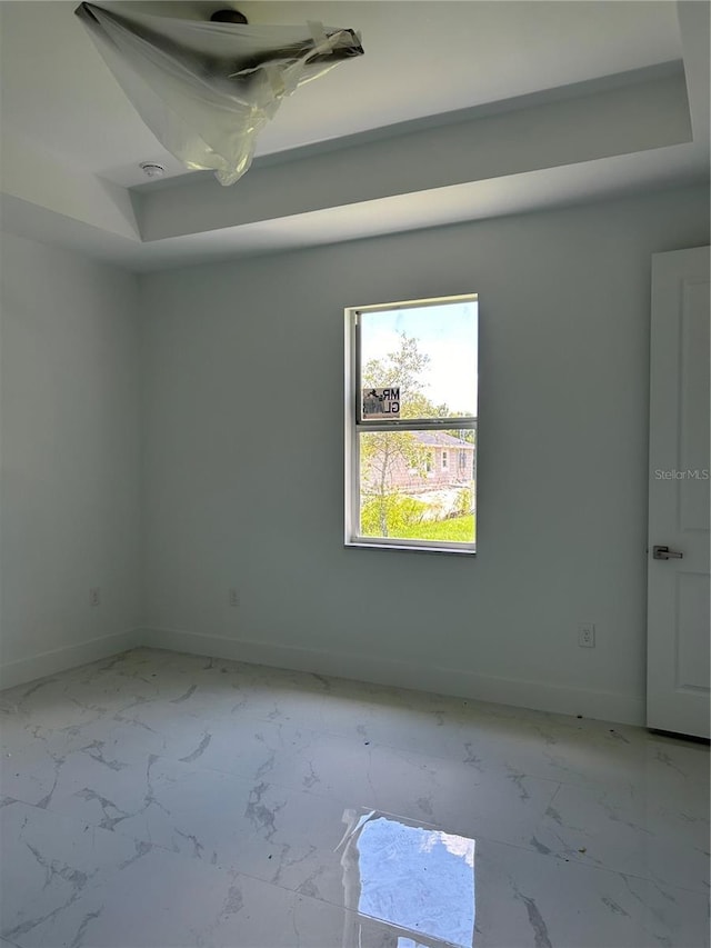 empty room with marble finish floor and baseboards