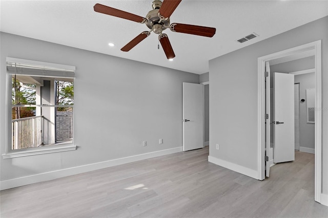 unfurnished bedroom with ceiling fan and light hardwood / wood-style flooring