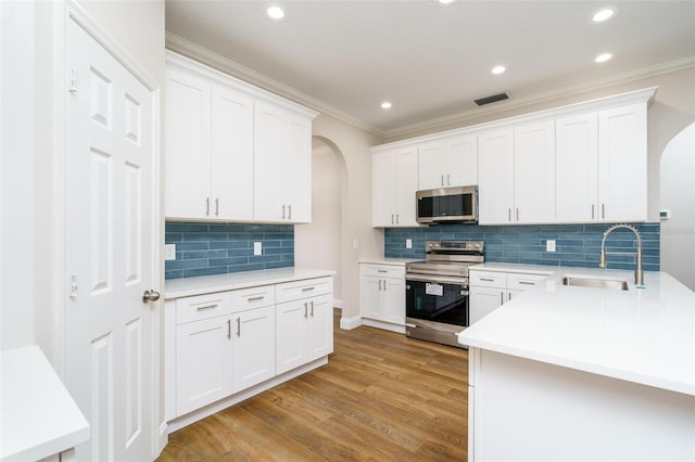 kitchen with white cabinetry, sink, and stainless steel appliances