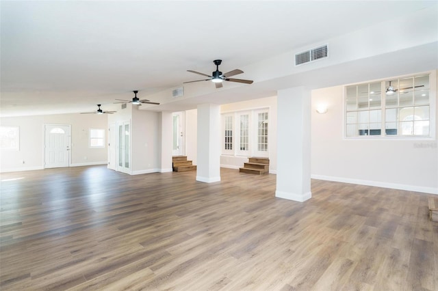 unfurnished living room featuring hardwood / wood-style flooring