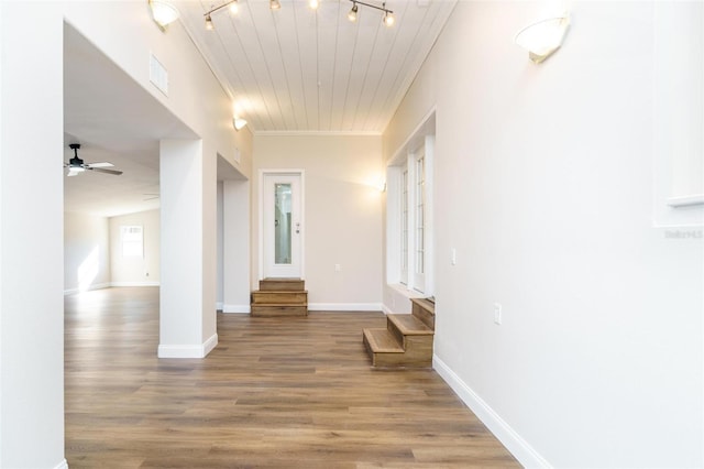 corridor with hardwood / wood-style flooring, wood ceiling, and track lighting