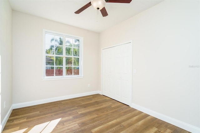 spare room featuring ceiling fan and hardwood / wood-style flooring