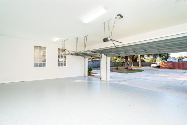 garage featuring a carport and a garage door opener