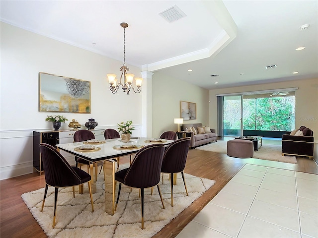 dining area featuring a chandelier and light hardwood / wood-style floors