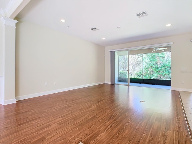 unfurnished room featuring hardwood / wood-style flooring and ceiling fan