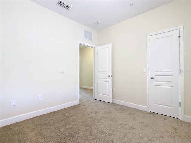 1300 Gilford Point Ln Unit 1300, Davenport, FL 33896 - unfurnished bedroom featuring carpet flooring and baseboards