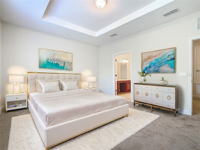 1300 Gilford Point Ln Unit 1300, Davenport, FL 33896 - carpeted bedroom featuring connected bathroom and a raised ceiling