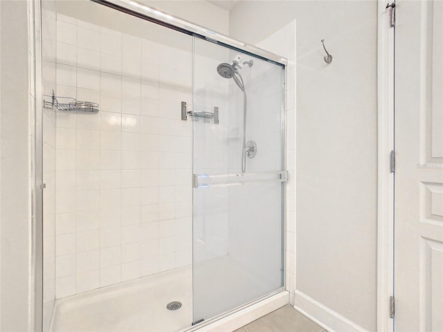 1300 Gilford Point Ln Unit 1300, Davenport, FL 33896 - bathroom featuring a stall shower and baseboards