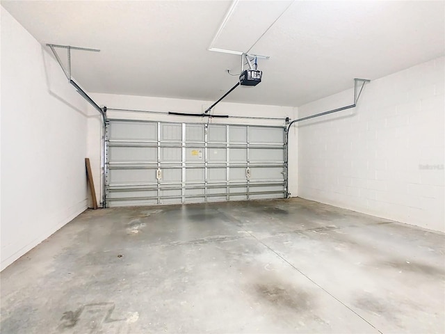 1300 Gilford Point Ln Unit 1300, Davenport, FL 33896 - garage with a garage door opener and concrete block wall