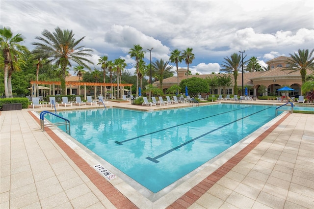 view of swimming pool featuring a patio area