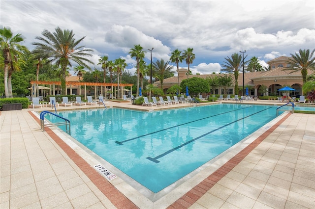 1300 Gilford Point Ln Unit 1300, Davenport, FL 33896 - community pool with a patio