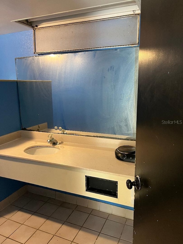 bathroom featuring tile patterned floors and sink