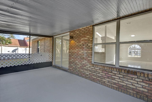 unfurnished sunroom featuring plenty of natural light