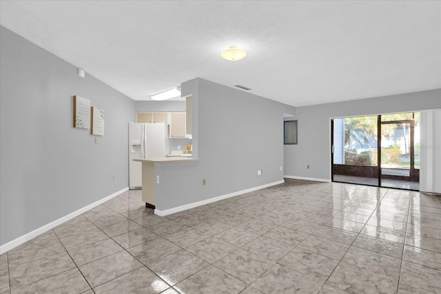 unfurnished living room featuring a textured ceiling