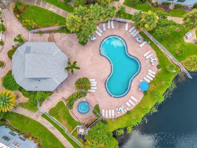 birds eye view of property with a water view