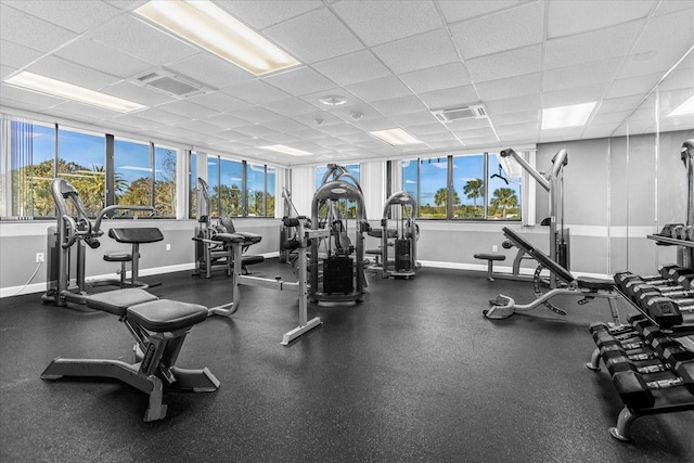 exercise room with a paneled ceiling