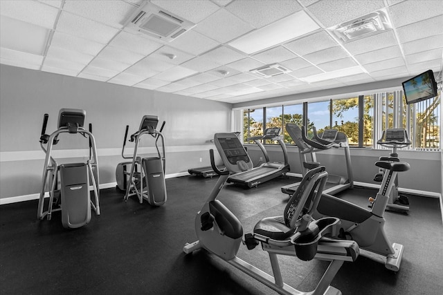 exercise room featuring a paneled ceiling