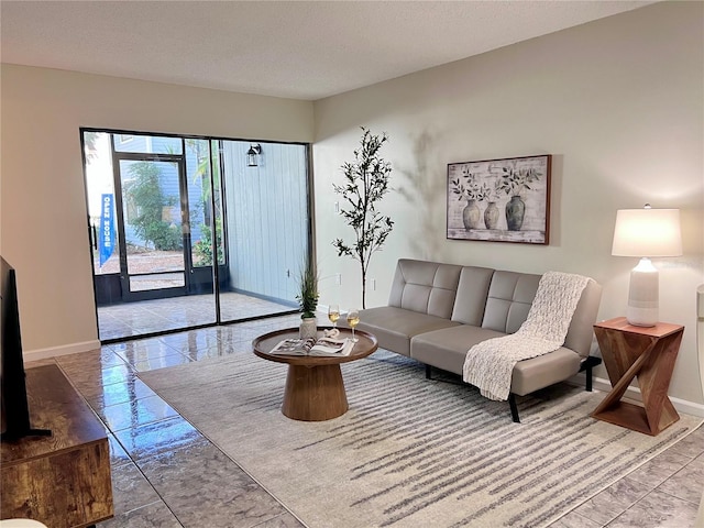 living room featuring a textured ceiling