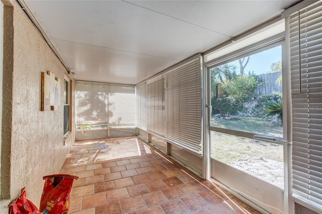 unfurnished sunroom featuring a healthy amount of sunlight