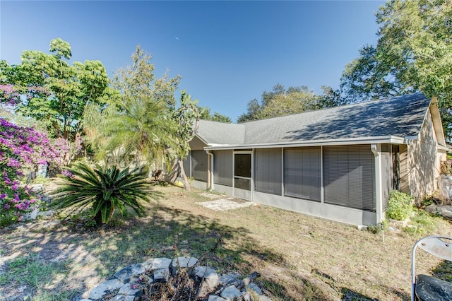 rear view of house with a sunroom