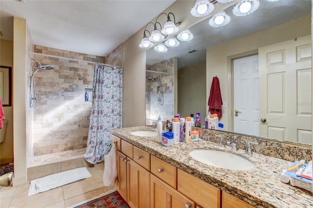 bathroom featuring tile patterned floors, a shower with curtain, and vanity